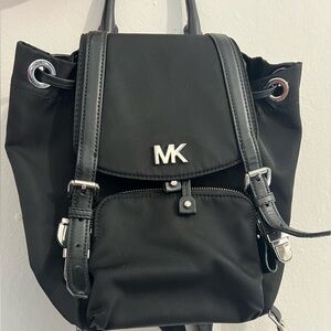 Black and Silver MK backpack.